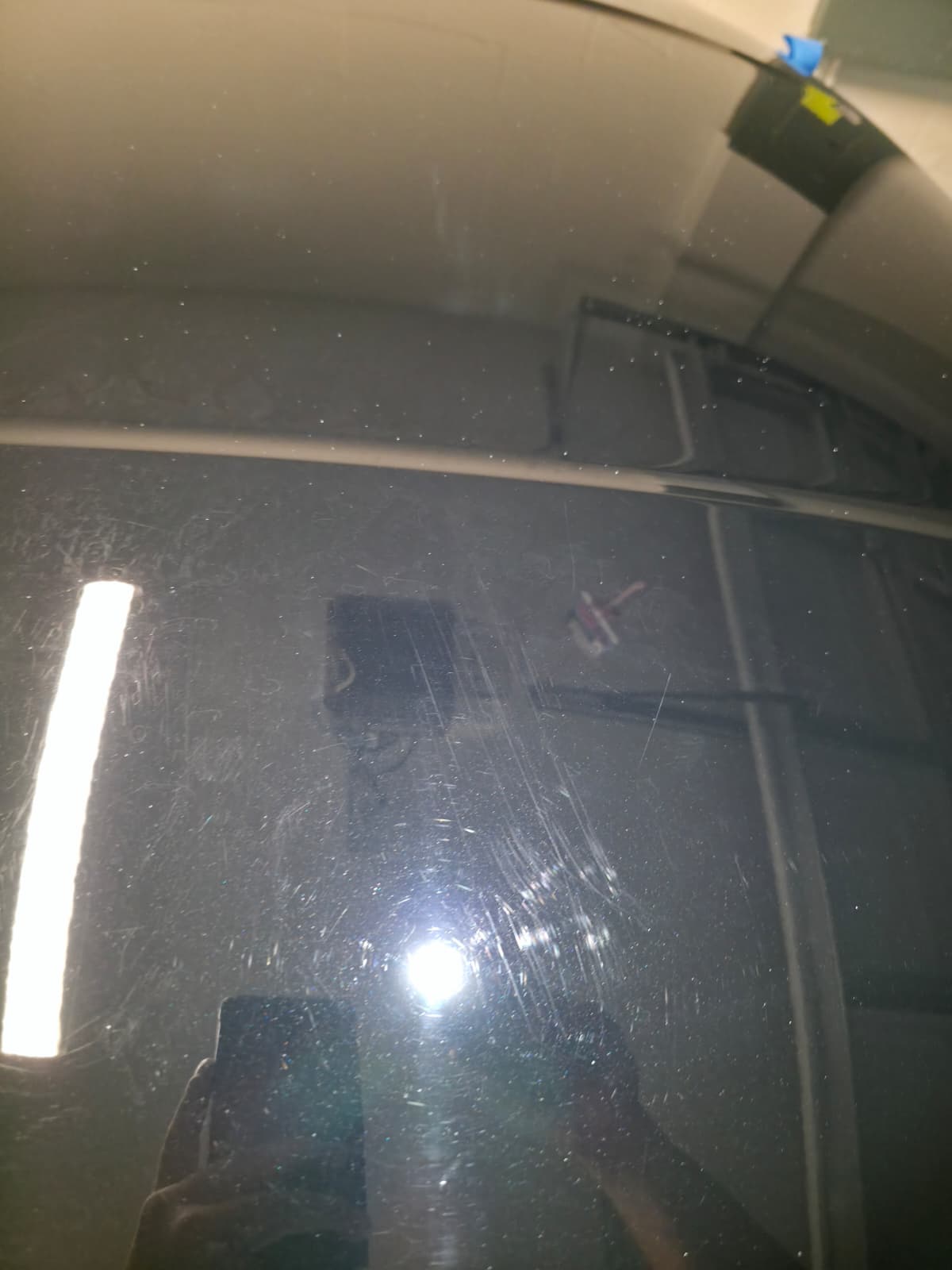 Reflections on a dark painted panel — Before